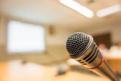 Black microphone in conference room ( Filtered image processed vintage effect. )