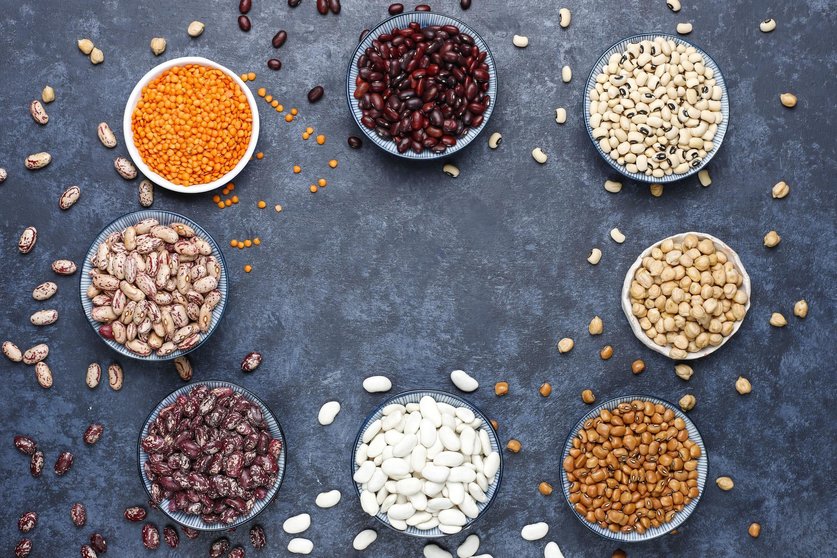 legumes-and-beans-assortment-in-different-bowls-on-light-stone-surface-top-view-healthy-vegan-protein-food