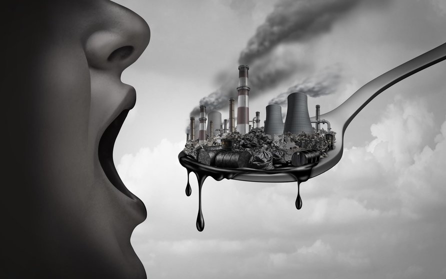 Concept of pollution and toxic pollutants inside the human body and eating contaminated food as an open mouth ingesting industrial toxins or climate change affects on the body with 3D illustration elements.