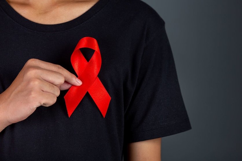 men-holding-red-ribbons-conceptual-awareness-hiv-world-aids-day-and-world-sexual-health-day