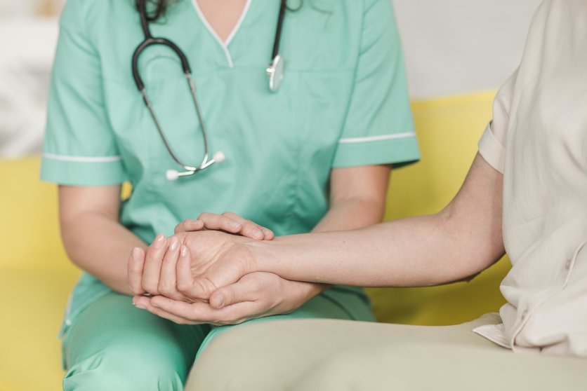 nurse-checking-pulse-on-female-patient-s-wrist