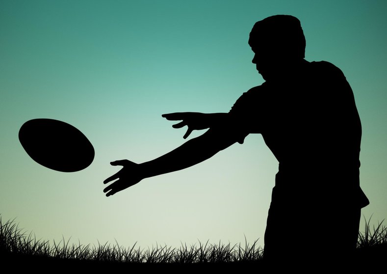Digitally generated image of player silhouette catching a ball
